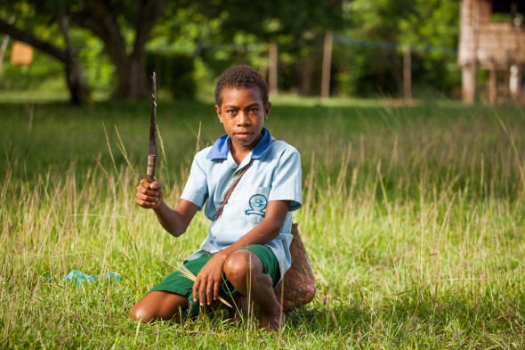 School boy with bush knife in Papua New Guinea