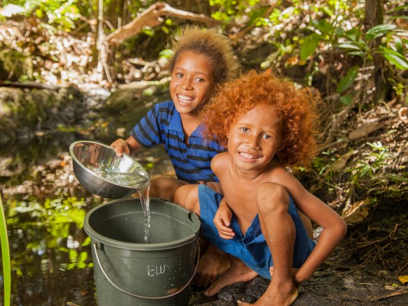 Children collecting water in Papua New Guinea